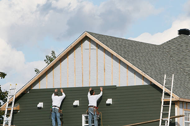 Professional Storm Damage Siding Repair technician working in West Milton, OH